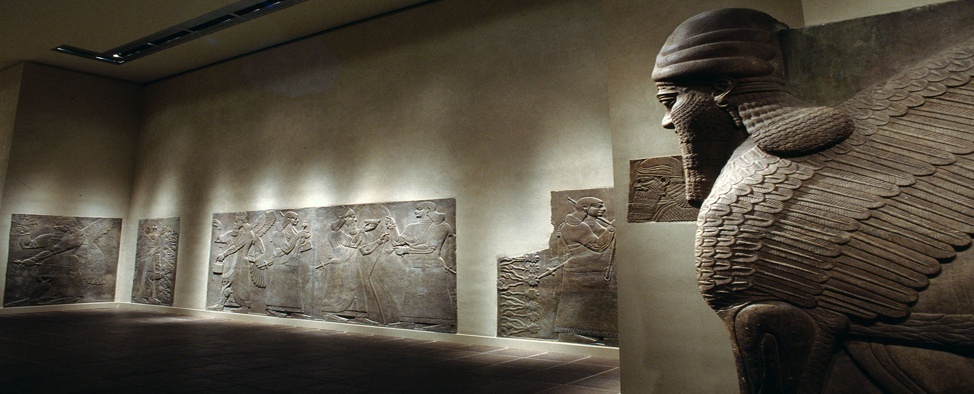 Two individuals in the Assyrian Court, Gallery 401 at the Metropolitan Museum of Art.