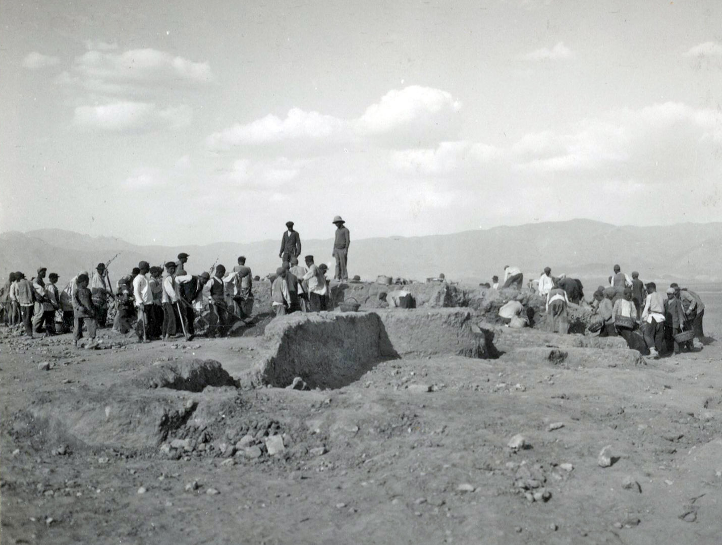a black and white photo of workers at the Falaki site