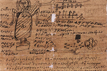 An ancient papyrus fragment featuring greek text and a rough sketch of a robed figure, depicting a deity or mythological character, surrounded by various symbols and drawings.
