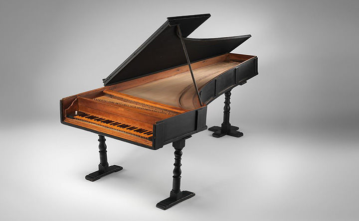 18th century Cristofori grand piano with lid propped open. 
