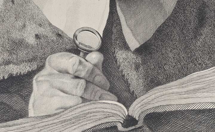 Detail of a print of a man's hand holding a magnifying glass to a book