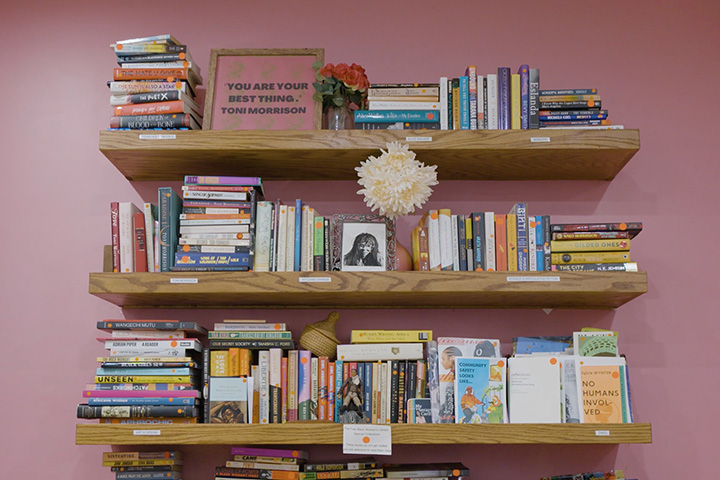 Floating shelves filled with books at the Free Black Women's Library.