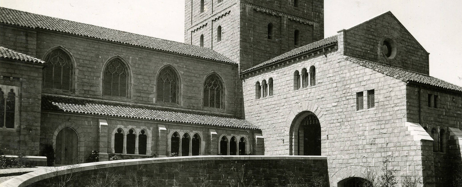 a black and white photograph of the Cloisters building exterior