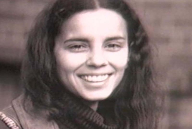 Monochrome photo of Ana Mendieta smiling