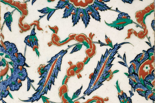 Tile with floral and cloud-band design