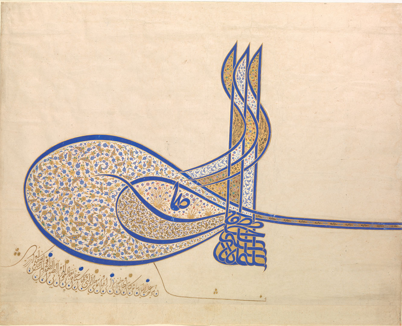 A highly ornate calligraphic Arabic signature in blue and decorated profusely with tiny painted and gilded flowers in blue and white
