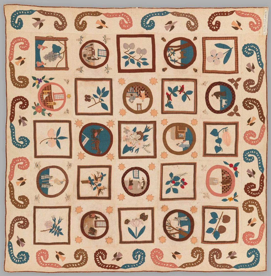 A blue, brown, and white cotton quilt with images inside circles and squares