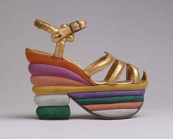 Golden ankle-strap sandal with a rainbow-colored platform.