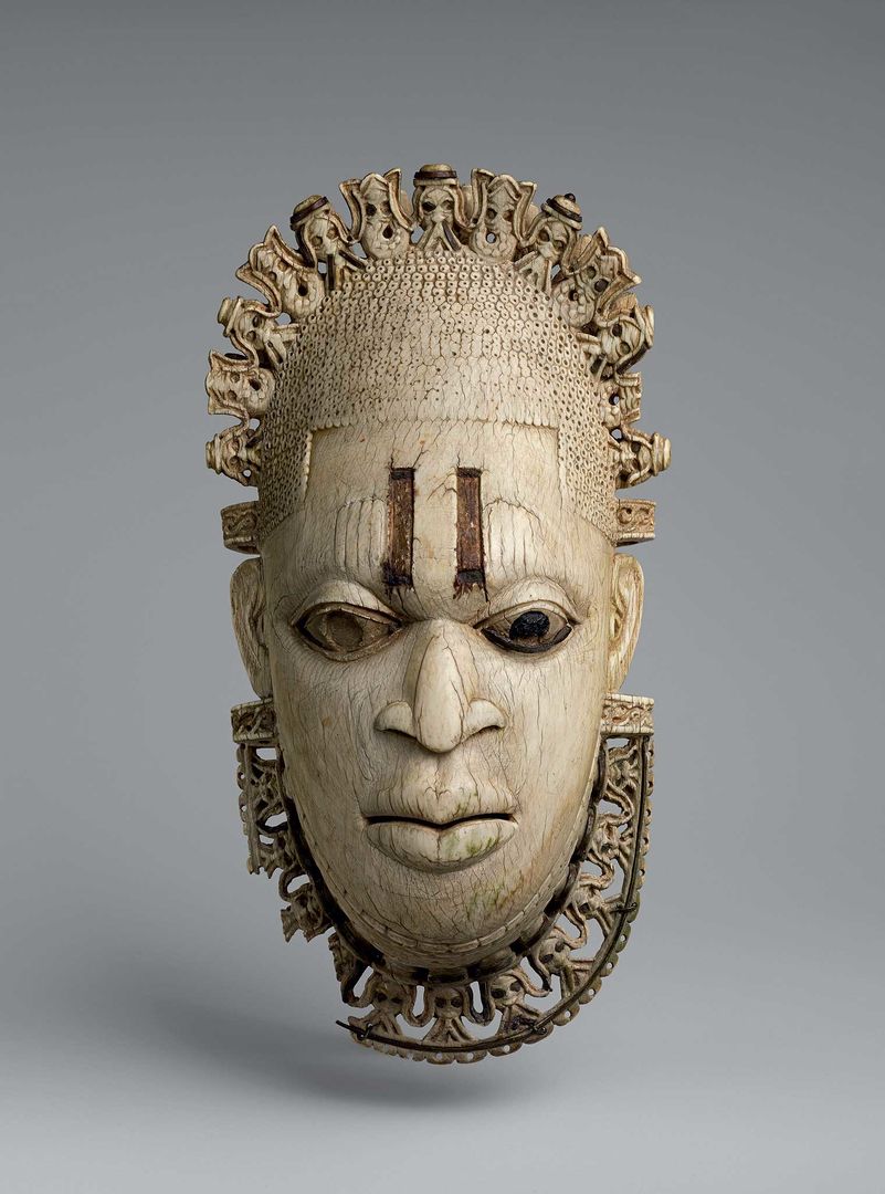 An ivory pendant mask of a Queen Mother—a native to Benin in Africa.