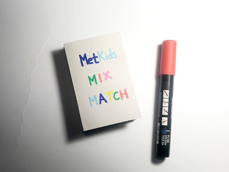 The cover of the final accordion book  reads MetKids Mix & Match beside an orange marker.