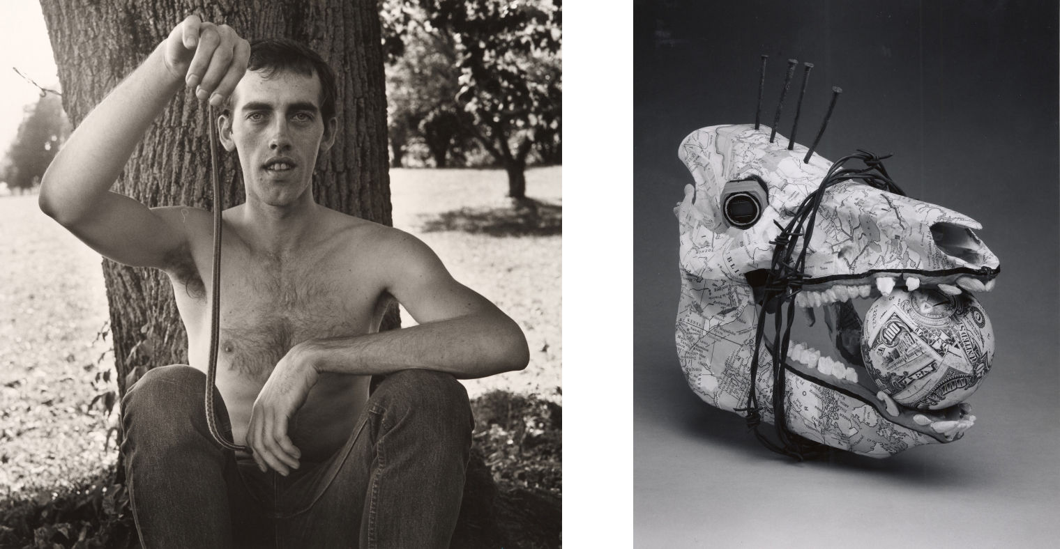 On the left, a black and white photograph of the artist David Wojnarowicz seated shirtless against a tree trunk holding up and dangling a small snake; on the right, a black and white studio photograph of an animalistic bone skull sculpture made with papier-mâché using typographic maps; the skull jaw is bound in barbed wire and. holds a sphere papier-mâchéd with paper currency.