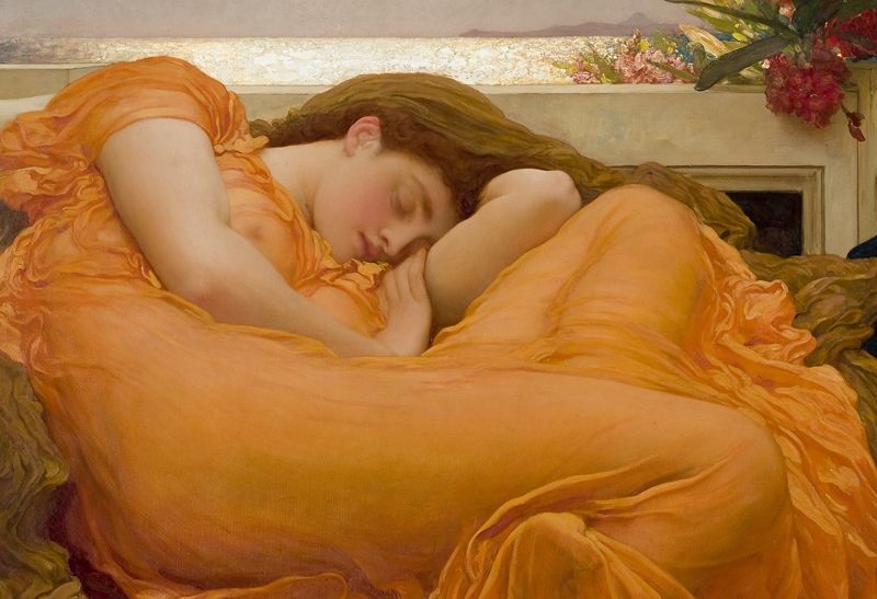 realistic painting of a white women with reddish hair sleeping in a curled up position on a large comfortable looking surface that has maroon red and brown clothe on it. The women is wearing a broad orange dress that is fairly transparent so the outline of her body is prominent. Behind her is a wall and behind that wall is a sunlit reflective body of water with a clear sky. A bright red flower creeps above the wall right above her.  
