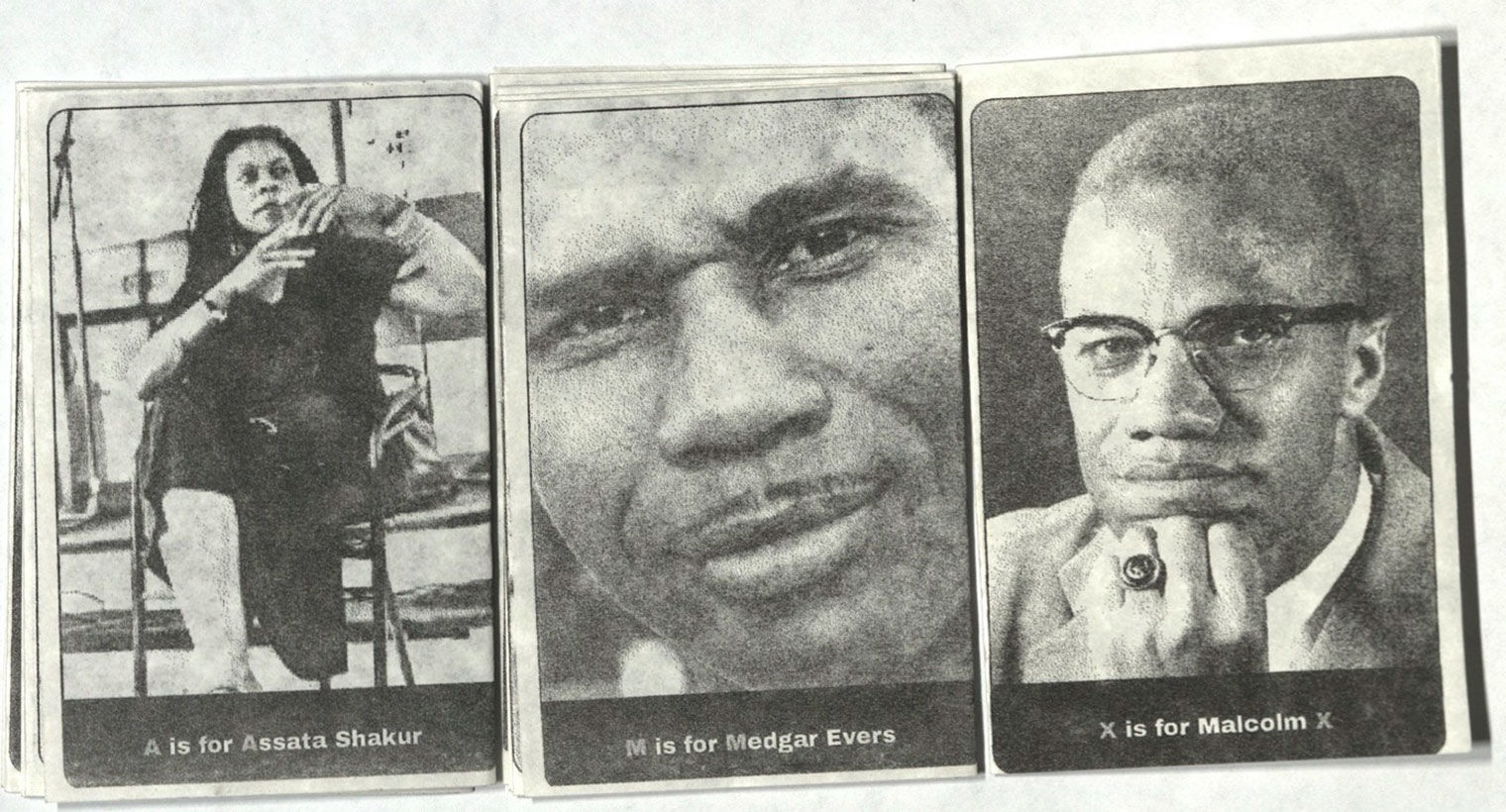 Three portraits, from left: Assata Shakur, Medgar Evers, Malcom X