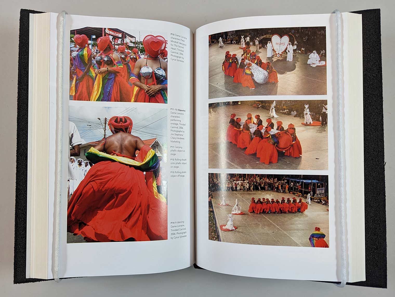 Colorful inner spread of people in bright red dresses and headware 